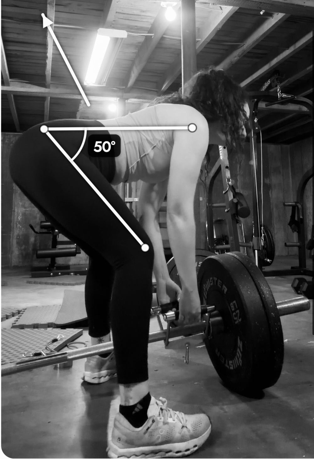 A coach's annotation over a client's deadlift video, measuring a 50 degree hip angle